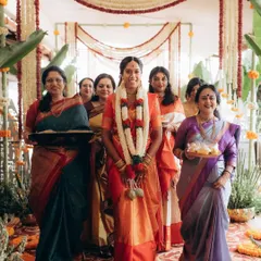 The bride's grand entrance during a traditional South Indian wedding. I capture the vibrant colors, the smiling faces of her family, and the beautiful rituals.