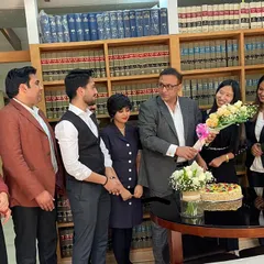 Our team celebrating and presenting flowers to Senior Advocate Pradeep Rai Sir on his birthday. We deeply value his guidance and leadership in our professional lives.