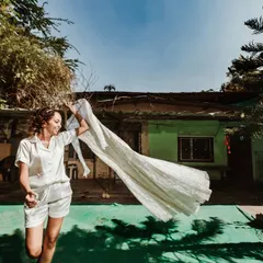 The bride and her dress. A simple, happy moment in the backyard before the day's events begin.