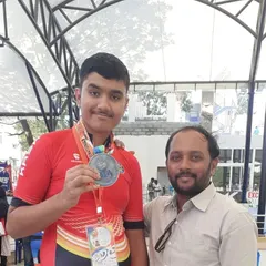 Shubham showing his hard-earned silver medal from the 60th National Championships.