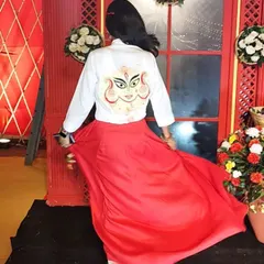 A full view of my custom Navratri outfit in motion. The hand-painted shirt, paired with a flowing red skirt, was designed to be both a personal expression and a conversation starter at the event.