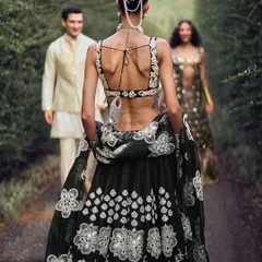 An intricate pearl-draped bun created for a campaign with designer Abhinav Mishra. This style combines classic elegance with detailed accessory work for a high-fashion ethnic look.