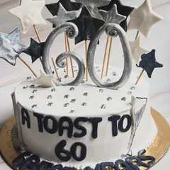 A toast to 60 great years! This milestone birthday cake is our Jack Daniel’s Belgian Chocolate flavor, customized with a fun star theme in black, white, and silver.