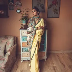 I love mixing vintage vibes with modern style. Here, I styled a beautiful yellow saree with a contemporary, heavily embroidered jacket-style blouse for a high-fashion ethnic look. The entire setup was curated to feel timeless and artistic.