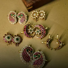 A beautiful flat-lay of our statement cuffs. This collection showcases a variety of designs, from paisley motifs to crescent moons, all crafted with colorful stones and polki.