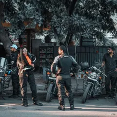 Event photography is about capturing candid interactions. This shot from a Royal Enfield Tribe Meet Up shows riders connecting between rides, showcasing the community aspect that is so important to the brand.