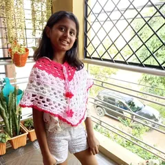This beautiful crochet poncho is perfect for kids. It's a great layering piece, and this customer looks adorable in hers.