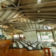 The main hall at Yogakshema, prepared for a class. The space is open, airy, and filled with a sense of calm, ready to welcome students.