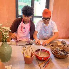 These boys are deeply engaged in their hand-building projects during a 'Clay & Play' session. We provide various tools and cutters to help them bring their creative visions to life.