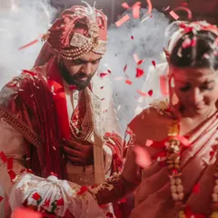 A dreamy, cinematic shot of the pheras, with smoke and confetti adding to the atmosphere. I focus on capturing the movement and emotion of this sacred ritual.