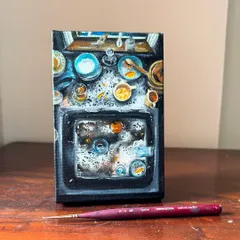 A straight-on view of the 'Simplicity of Chaos' painting. I used oil paints to capture the reflections in the water and the textures of the leftover food and soap bubbles.