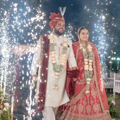 A grand entrance for the bride and groom, walking hand-in-hand through a path lined with sparkling cold pyros. This is how I create a spectacular start to your new life together.