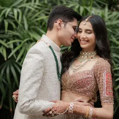 A tender and joyful moment between the couple, their happy smiles and close embrace perfectly capturing the feeling of 'just married'.