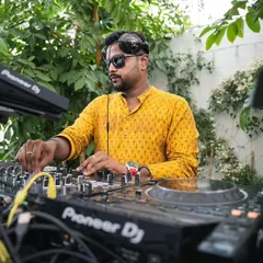 DJing a daytime Mehendi party. I adapt my style and even my attire to fit the vibe of your event, ensuring the music is perfect for any wedding celebration, day or night.