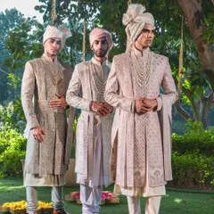 A vision of coordinated grandeur for the groom and his groomsmen. This image showcases a harmonious collection of our bespoke sherwanis in complementary pastel tones, each piece individually tailored yet collectively telling a story of celebration.