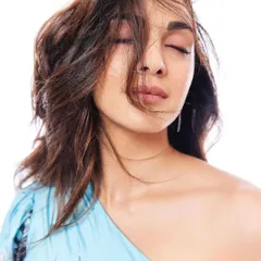 An intimate, expressive shot of Kiara Advani from the Stayfree campaign. Even in a simple portrait, the styling of the one-shoulder dress and soft hair contributes to the overall mood of gentle confidence.