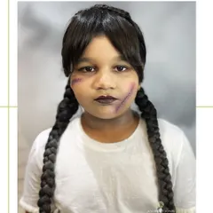 We also do themed makeup for kids! Here's our take on the iconic Wednesday Addams, complete with her signature braids and moody makeup.