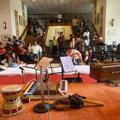 A 'Threshold' session in Panchagani, filled with music, poetry, and conversations. You can see the informal, relaxed setup with instruments and artists ready to share, which is the essence of a private gathering.