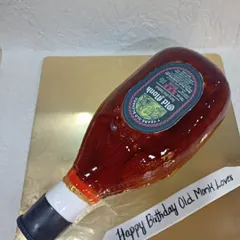 Can you believe this is a cake? I specialize in hyper-realistic designs like this Old Monk bottle cake, perfect for surprising someone with a truly unique and memorable sculpted dessert.