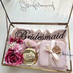 Asking your best friends to be your bridesmaids is a huge moment. I designed this personalized glass keepsake box with a satin robe, a custom mirror, and a jewelry organizer to make the proposal unforgettable.