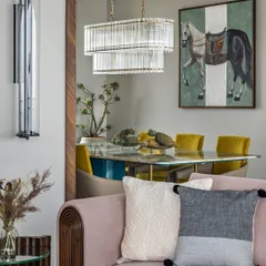 This view from the living room into the dining area of a 4300 sq. ft. Mumbai duplex captures my love for seamless flow. The minimalist elements and subtle color play create a sense of understated luxury, connecting the spaces with effortless elegance.
