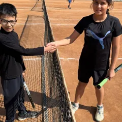A handshake between competitors at our internal tournament. We teach our players to respect their opponents, win or lose.
