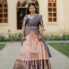 The grace of a traditional langa voni is unmatched. For Brunda, we converted her saree into this elegant pink and grey half saree, perfect for her professional photoshoot.