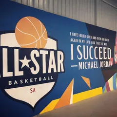 Another angle of our court's mural. The art and our logo represent the high standard of excellence and commitment we strive for at ABSA.