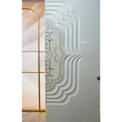 This is not just a door; it's a piece of art. We used premium Corian material and precision CNC cutting to create this stunning door with flowing, layered contours and ornamental details.
