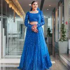 Seeing my client shine in this custom royal blue lehenga is what it's all about. This piece features full-sleeve detailing and head-to-toe sequin work, making it a perfect, modern choice for a sangeet or reception.