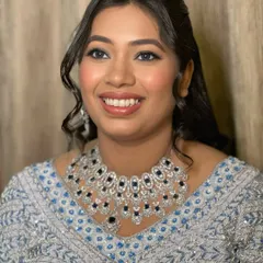 Setting the night on fire with a glam look that sets the mood just right. This bride's reception makeup features a flawless base, defined eyes, and a beautiful glow.