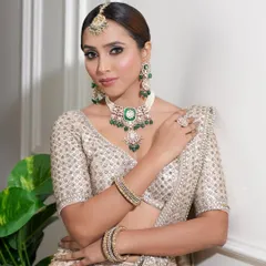 A direct look at this regal bridal style. The defined, smokey eyes and perfectly sculpted features create a powerful yet elegant statement, perfect for the modern bride.