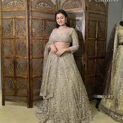 The full view of this elegant beige sequin lehenga. It has a beautiful flare and is perfect for a reception or engagement party.
