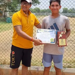 Anay Pandey receiving his award for winning the Under-14 Boys singles title at the Championship Series Tournament in Sonepat. Our Noida center training program is producing consistent champions.
