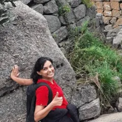 Our training prepares you for life's adventures. This client happily gives a thumbs-up during a tough hike, crediting our intense Zumba and core exercises for giving her the strength and stamina to conquer the challenge.