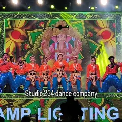 We begin many auspicious corporate events with a traditional Ganesh invocation. Our dancers, in vibrant orange and blue costumes, perform against a large LED screen displaying sacred imagery, setting a powerful and respectful tone for the evening.
