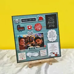 This custom scrapbook-style frame is perfect for celebrating a friendship. It's filled with photos, fun stickers, and quotes that represent the bond between friends.