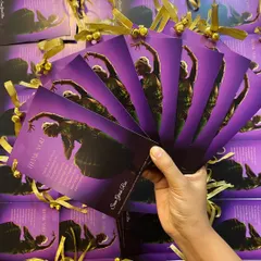 Custom-made thank you cards for a beautiful Bharatanatyam Arangetram. The purple and gold design, tied with ghungroos, adds a traditional and personal touch.