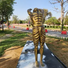 Part of our Surya Namaskar yoga statue series, this piece captures the 'Hasta Uttanasana' (Raised Arms Pose) with a beautiful golden finish.