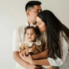 A beautiful family embrace. These bright, minimalist sessions are perfect for capturing the love in a growing family, with everyone focused on each other.
