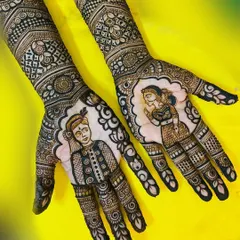 A beautiful example of bridal portrait henna. The groom's portrait is on the left hand and the bride's on the right, each framed with delicate patterns that draw the eye to the central figures.