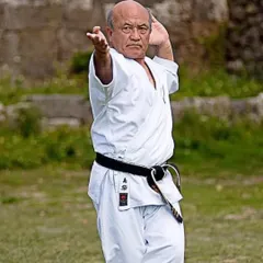 Grand Master Zenpo Shimabukuro demonstrates a technique with the precision and power that comes from a lifetime of dedicated practice. This is the standard of excellence we pursue in our training.