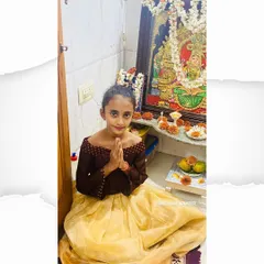 This sweet girl is ready for a festival in her custom outfit. I designed this off-shoulder top in a contrasting brown fabric to pair with a light yellow pleated skirt made from a soft, traditional material.