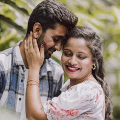 A close-up portrait from a pre-wedding shoot, capturing the couple's tender and affectionate expressions.