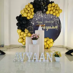 A full view of the elegant black and gold party corner, perfect for adult birthdays or milestone celebrations.