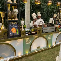 A close-up of our 'Dan Anish' live counter, where chefs prepare specialized dishes. We pride ourselves on offering unique and custom live stations tailored to your event's theme.