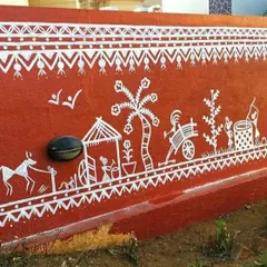 A close-up of the Warli mural showing scenes of farming and daily village activities. This type of detailed storytelling is what makes traditional Indian wall art so special and personal.