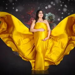 Another take on the flowing fabric shoot, this image captures a sense of power and grace. The dark, floral background makes the yellow fabric pop.