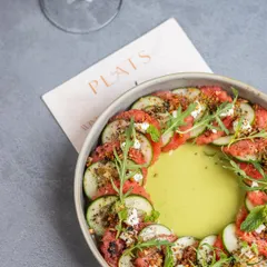 A salad that’s a composition of sweet, heat, and crunch. Our Watermelon and Cucumber salad is dressed in a jalapeño-laced raw mango agua chile and finished with feta, black lime salt, and toasted quinoa granola.