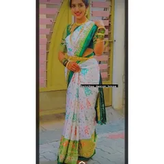 Bride Priyanka looking absolutely stunning in her custom ensemble. I designed the green embroidered blouse to perfectly match the traditional motifs and border of her beautiful white silk saree.
